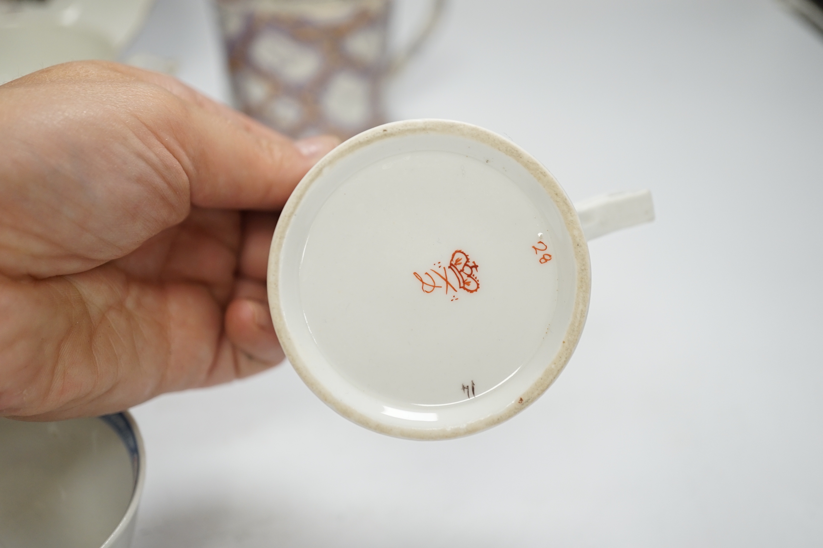 Two Derby porcelain coffee cans and one saucer, a tea bowl, a pearlware mug and a mid 18th century Meissen cup and saucer, tallest mug 8cm high